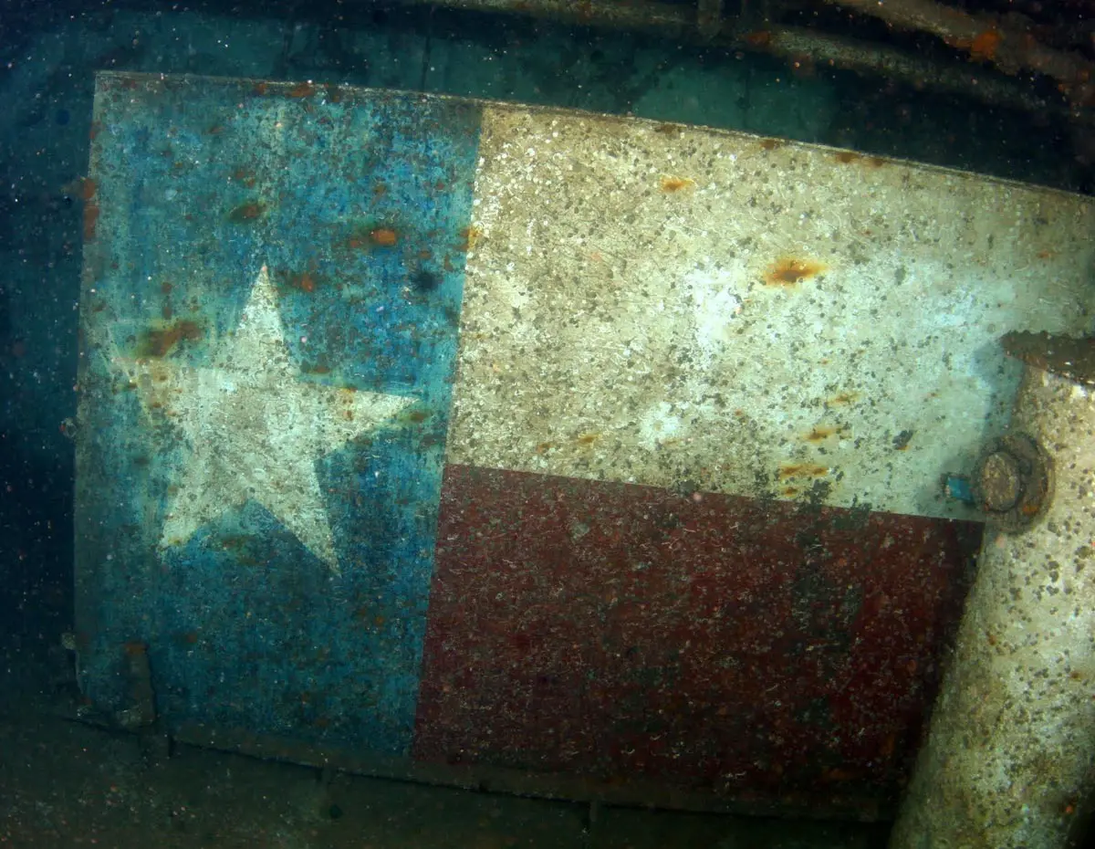 Texas flag painted on the inside of the Texas Clipper hull, revealed after Hurricane Ike